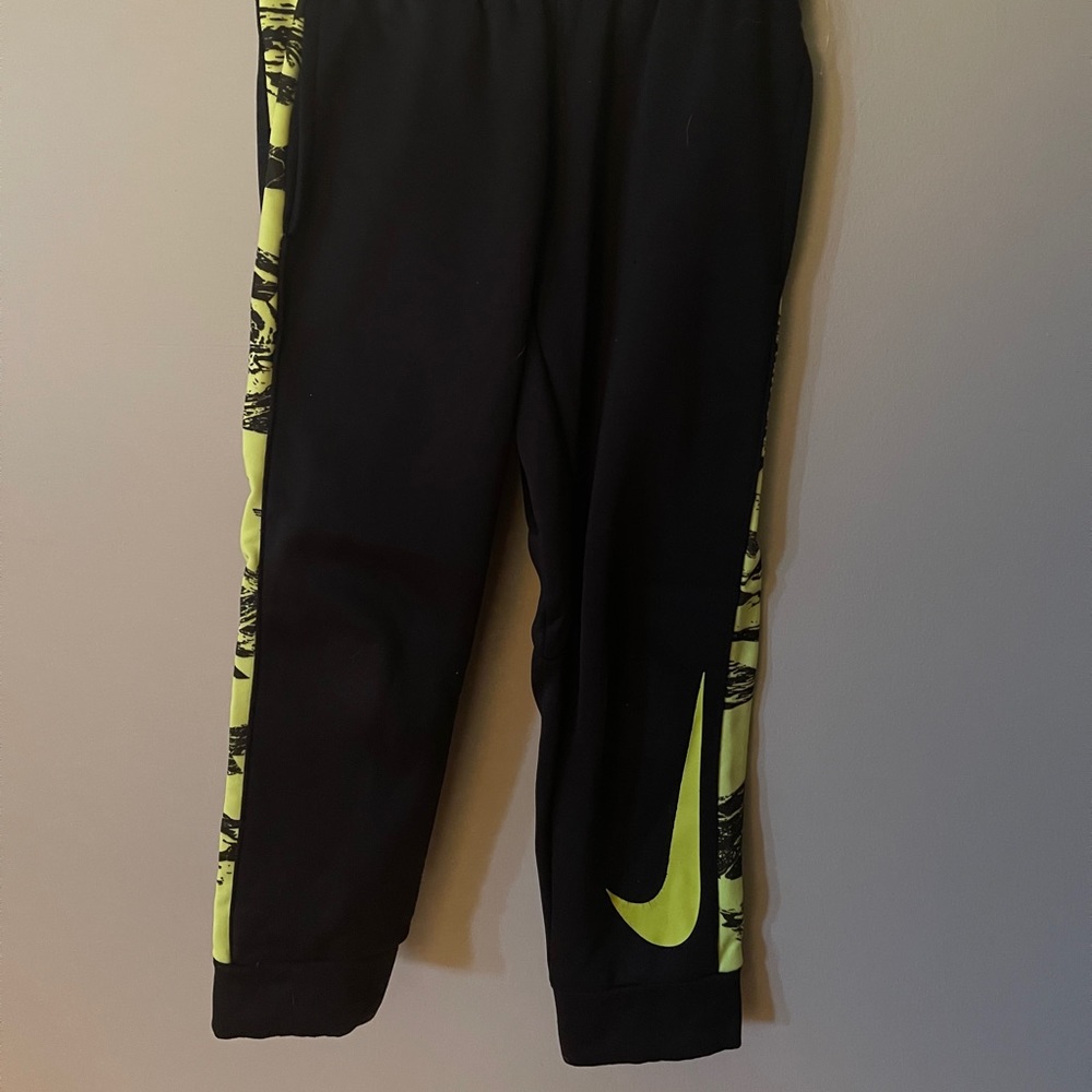 Black, dri fit Nike sweatpants.
